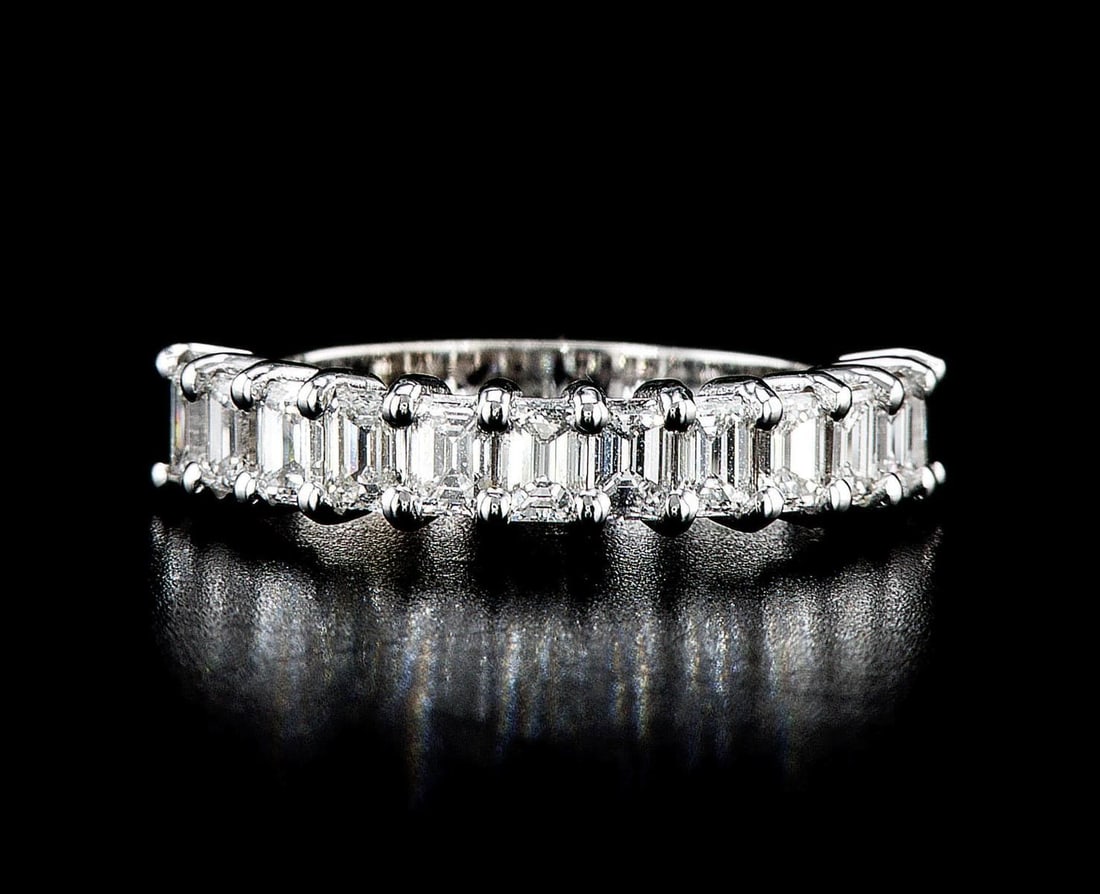 14kt White Gold 1.77ctw Diamond Ring: One 3.49 gr. 14kt White Gold Diamond Ring Jewelry Weight: 3.49Grs Total Diamonds Weight: 1.77Cts Main Stones Description: Quantity: 12 Cut and shape: Emerald Cut Carats Weight: 1.77 Clarity: VS1-VS2 C