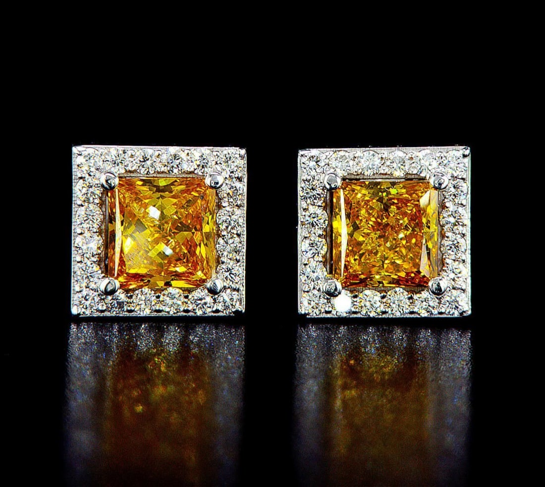 14kt White Gold 2.31ctw Diamond Earrings: One pair of 14k white gold earrings (14k stamped), each set with one center lab grown diamond and small lab grown diamonds around and on the sides. Jewelry Weight: 2.98Grs Total Diamonds Weight: 2.31C