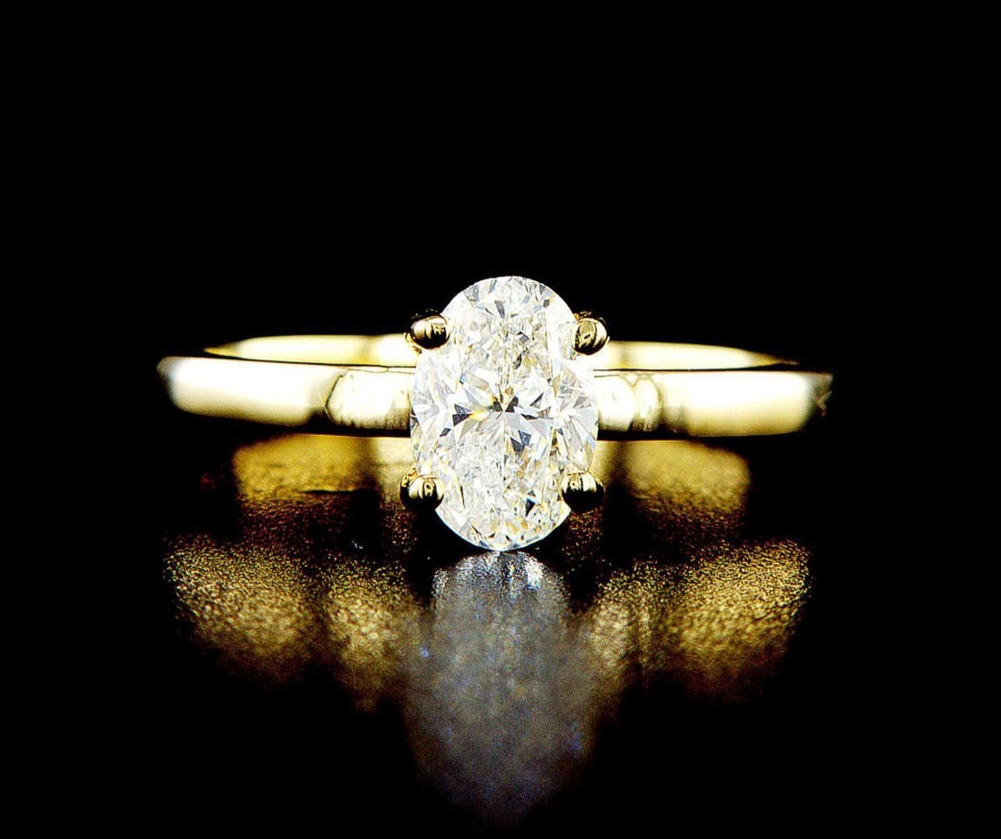 14k yellow gold 1.01ctw Diamond Ring: One 14k yellow gold ring (14k stamped), set with one center natural diamond. Jewelry Weight: 2.65Grs Total Diamonds Weight: 1.01Cts Main Stones Description: Quantity: 1 Cut and shape: Oval Carats Weig