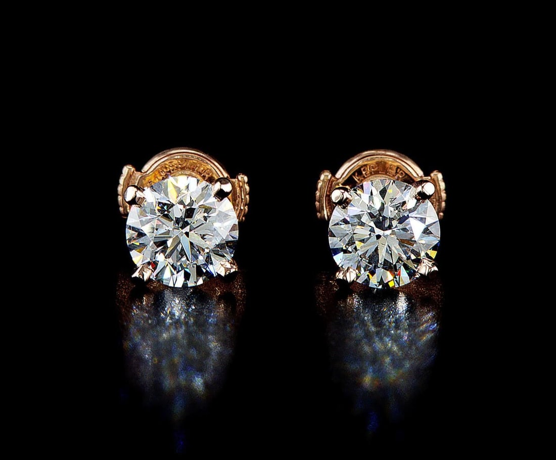 14kt Rose Gold 2.18ctw Diamond Earrings: One pair of 14k rose gold earrings, each set with one lab grown diamond. Jewelry Weight: 1.82Grs Total Diamonds Weight: 2.18Cts Main Stones Description: Quantity: 2 Cut and shape: Round Brilliant Cara