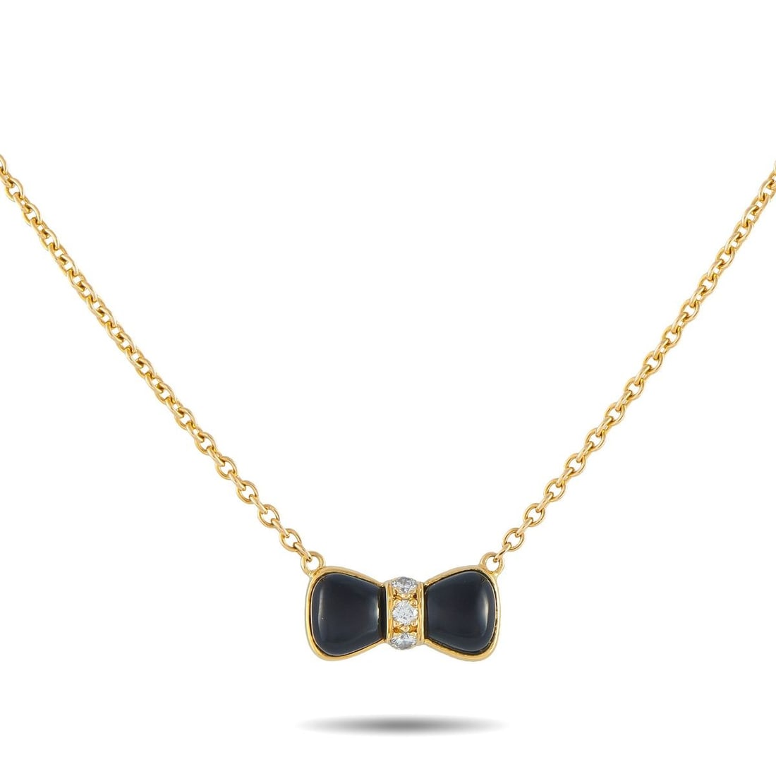 VAN CLEEF & ARPELS 18K YELLOW GOLD DIAMOND AND ONYX BOW NECKLACE: A bow-shaped pendant makes this Van Cleef & Arpels necklace incredibly charming. Crafted from 18K Yellow Gold, the feminine design comes to life thanks to Onyx accents and sparkling Diamonds. The pend