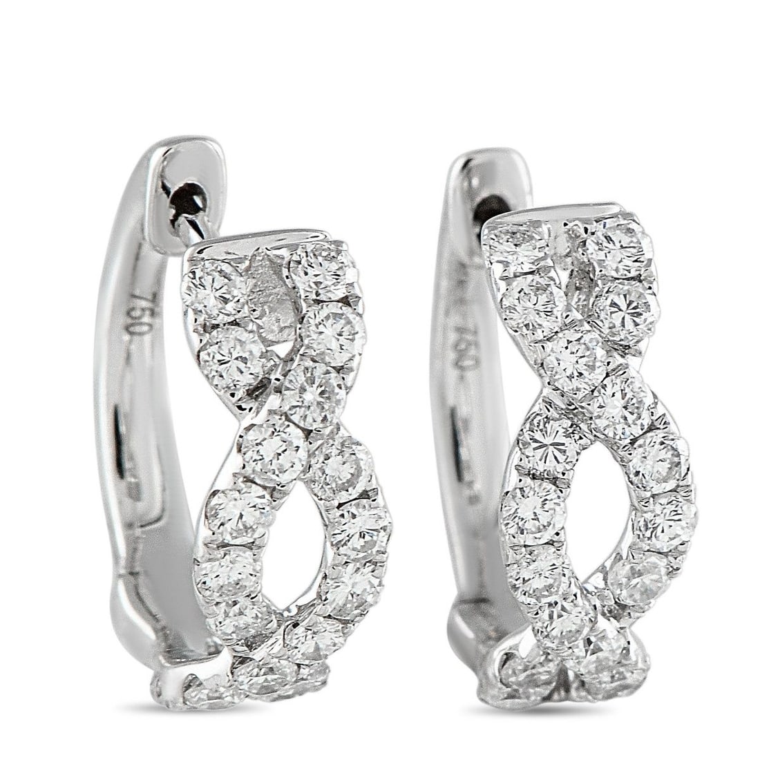 18K WHITE GOLD 0.67CT DIAMOND EARRINGS: An intricate 18K White Gold setting makes these earrings anything but basic. Understated enough for everyday wear, Diamonds with a total weight of 0.67 carats make them seemingly radiate light. Each