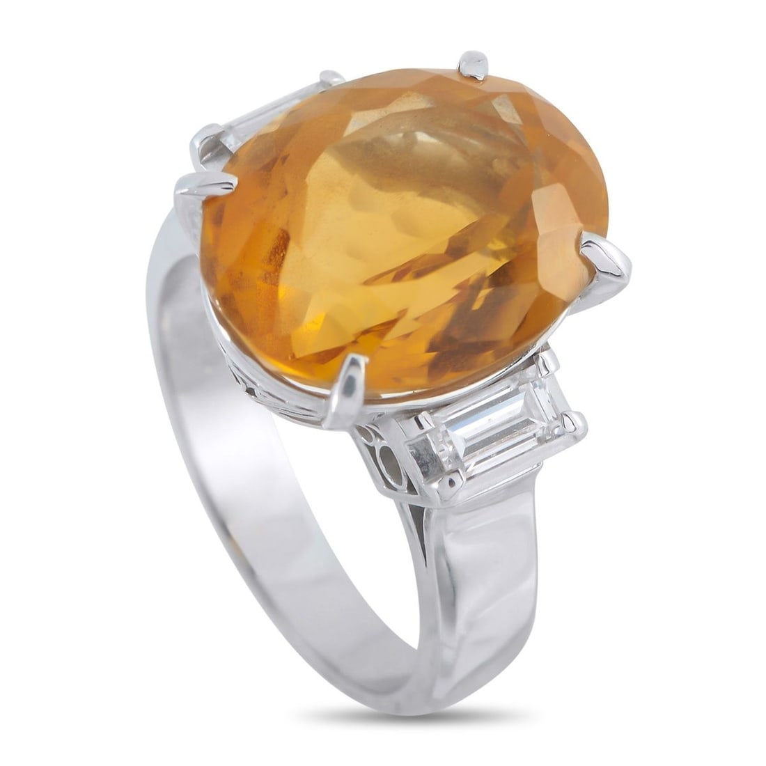 PLATINUM 0.46CT DIAMOND AND CITRINE RING: A detailed Platinum setting makes this eye-catching ring simply extraordinary. At the center, a breathtaking 9.70 carat Citrine gemstone provides a stunning focal point. Diamond baguettes totaling 0.4