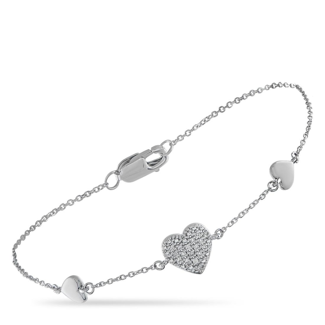 18K WHITE GOLD 0.05CT DIAMOND HEART BRACELET: This luxury bracelet is endlessly charming. A trio of stylish heart motifs elevate this pieces delicate 6.75 chain. At the center, Diamonds totaling 0.05 carats make it come alive every time it