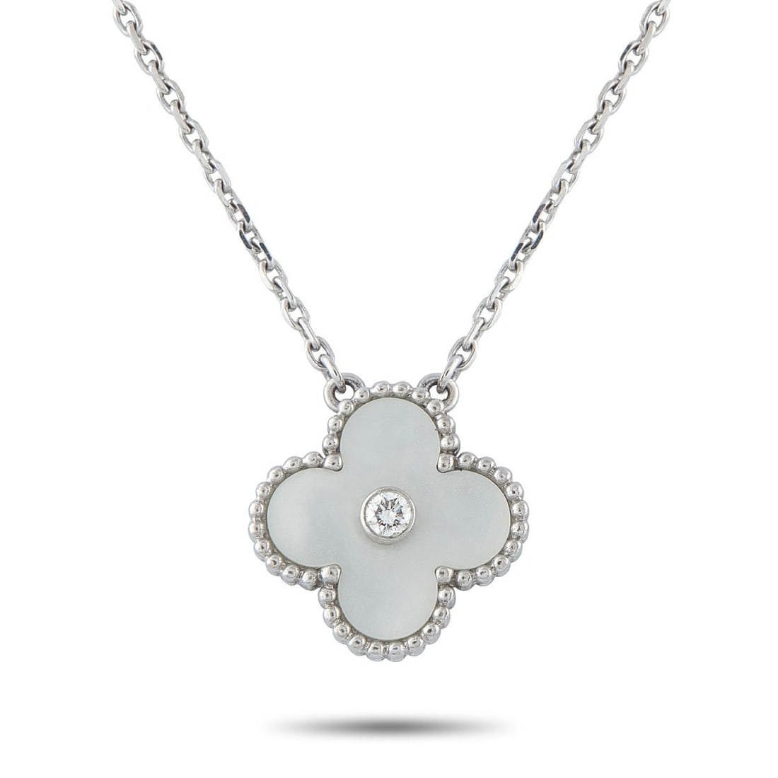 VAN CLEEF & ARPELS HOLIDAY ALHAMBRA 18K WHITE GOLD DIAMOND AND MOTHER OF PEARL PENDANT NECKLACE: Produced in limited quantities exclusively for the festive season, the Holiday Alhambra collection has long held a special place among Van Cleef & Arpels collectors. This 2009 edition marked a notable