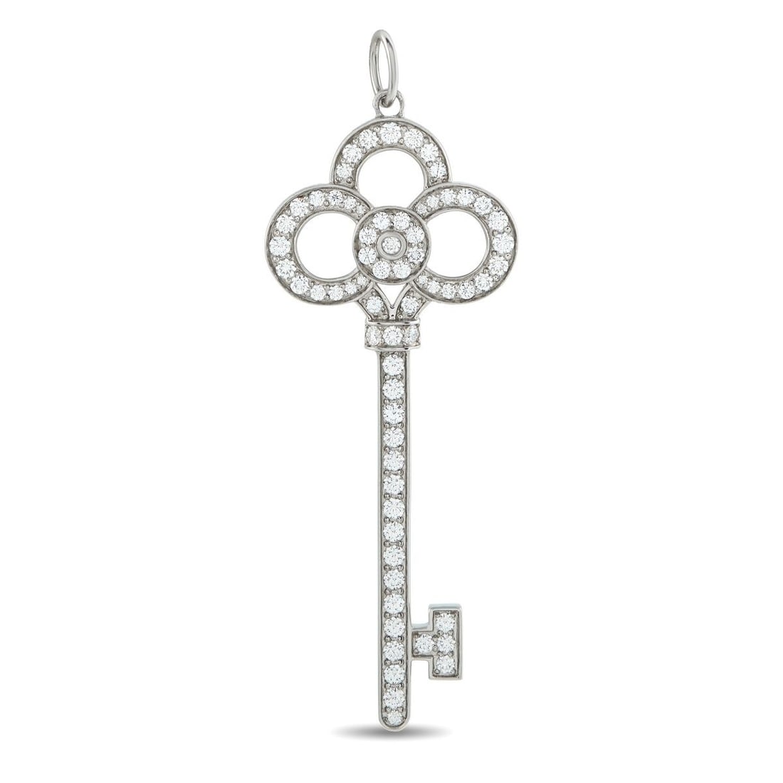 TIFFANY & CO. KEYS PLATINUM 0.64CT DIAMOND CROWN KEY PENDANT: This Crown Key pendant from the Tiffany & Co. Keys collection is simply dazzling. Crafted from Platinum, pav Diamonds with a total weight of 0.64 carats allow it to emit brilliant sparkle. It measures