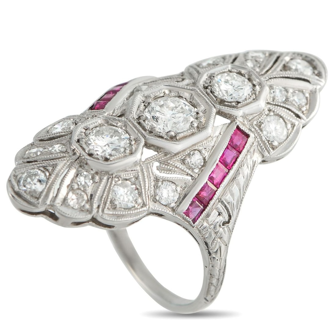 PLATINUM 1.0CT DIAMOND AND RUBY RING: This dramatic ring is meant to make a statement. Bold and breathtaking, the intricate Platinum setting is elevated by Diamonds with a total weight of 1.0 carats. Ruby accents add an eye-catching pop o