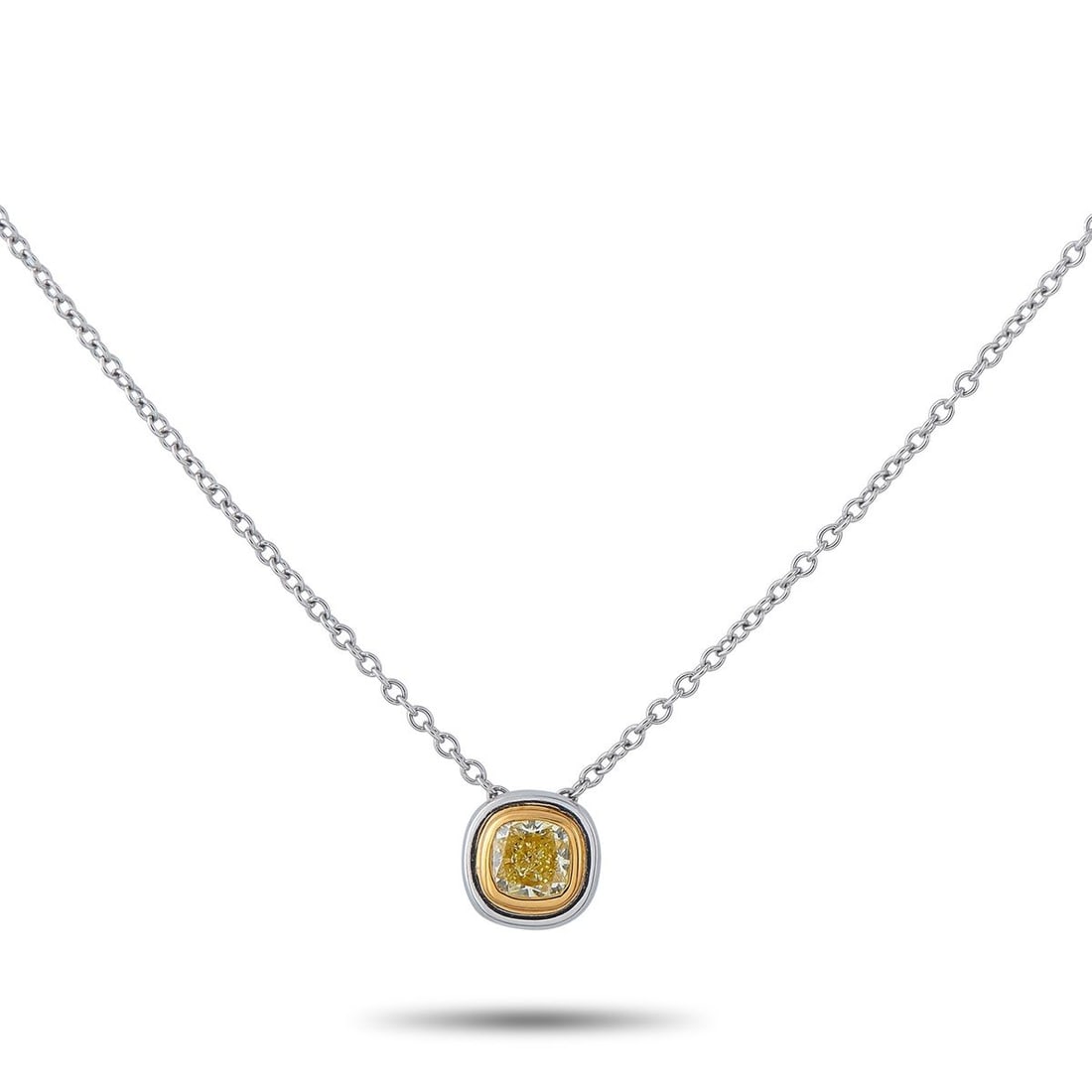 TIFFANY & CO. PLATINUM 0.40CT FANCY YELLOW DIAMOND PENDANT NECKLACE: A simple, elegant design makes this Tiffany & Co. necklace an effortless choice. At the center of the Platinum pendant, a 0.40 carat Fancy Yellow Diamond adds a stylish pop of color. The pendant measu