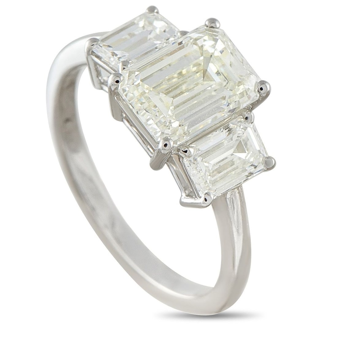 PLATINUM 3.02CT DIAMOND THREE-STONE RING: Three stones, one of the most enduring layouts in fine jewelry, and still among the most meaningful. This piece keeps the idea remarkably pure, with a 2.07 carat J-VS1 emerald-cut center diamond flank