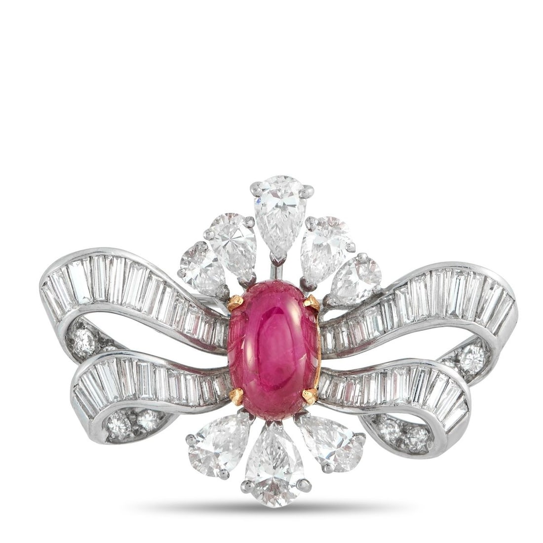 PLATINUM 4.14CT DIAMOND AND RUBY BROOCH: Ribbon-like metalwork makes this luxury brooch incredibly delicate in design. Diamonds with a total weight of 4.14 carats highlight the intricate Platinum setting. At the center, a 7.37 carat Ruby cab