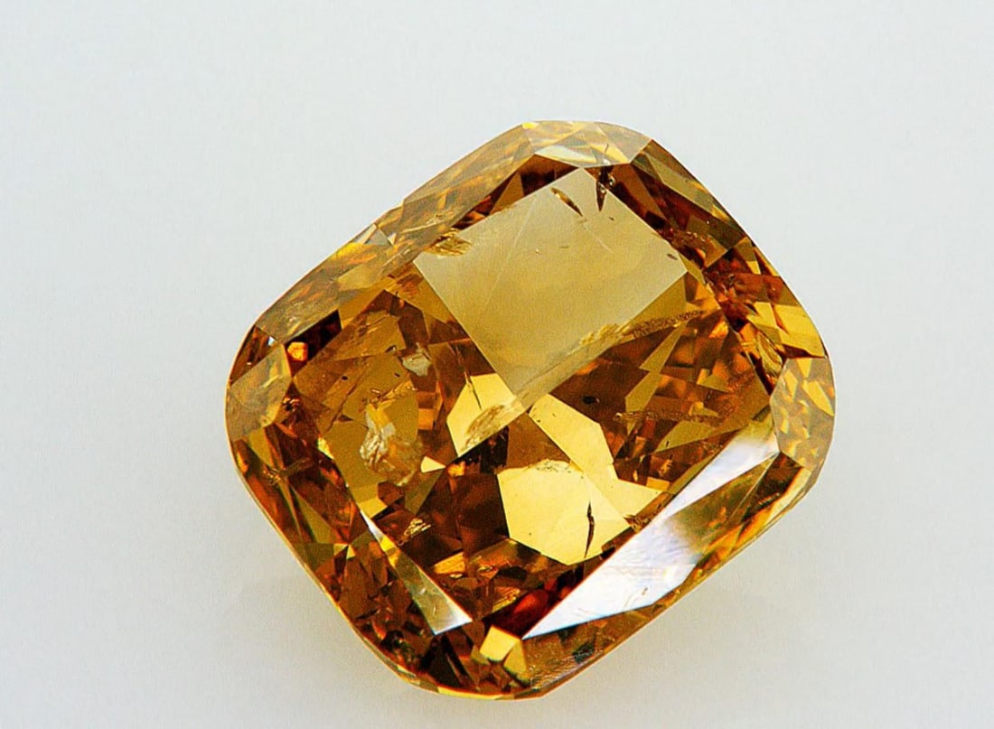 Natural 3.01 ct, Color Fancy Deep Brownish Orangy Yellow/ GIA Graded Diamond: Lab/Natural Diamond: Natural Carat Weight: 3.01 Color Grade: Fancy Deep Brownish Orangy Yellow Clarity Grade: Model: Cushion Modified Size: 8.79 x 7.81 x 4.53 Certificate Number: 2235134671 Certified 