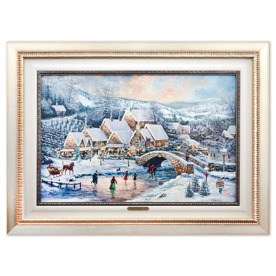 Thomas Kinkade- Hand Embellished Giclee on Canvas "Christmas at Lamplight Village": Artist: Thomas Kinkade. Medium: Hand Embellished Giclee on Canvas. Title: Christmas at Lamplight Village. Size: 17.5" x 26.5". Measures approx. 27" x 32" (framed). Signature: Hand signed and numbered.