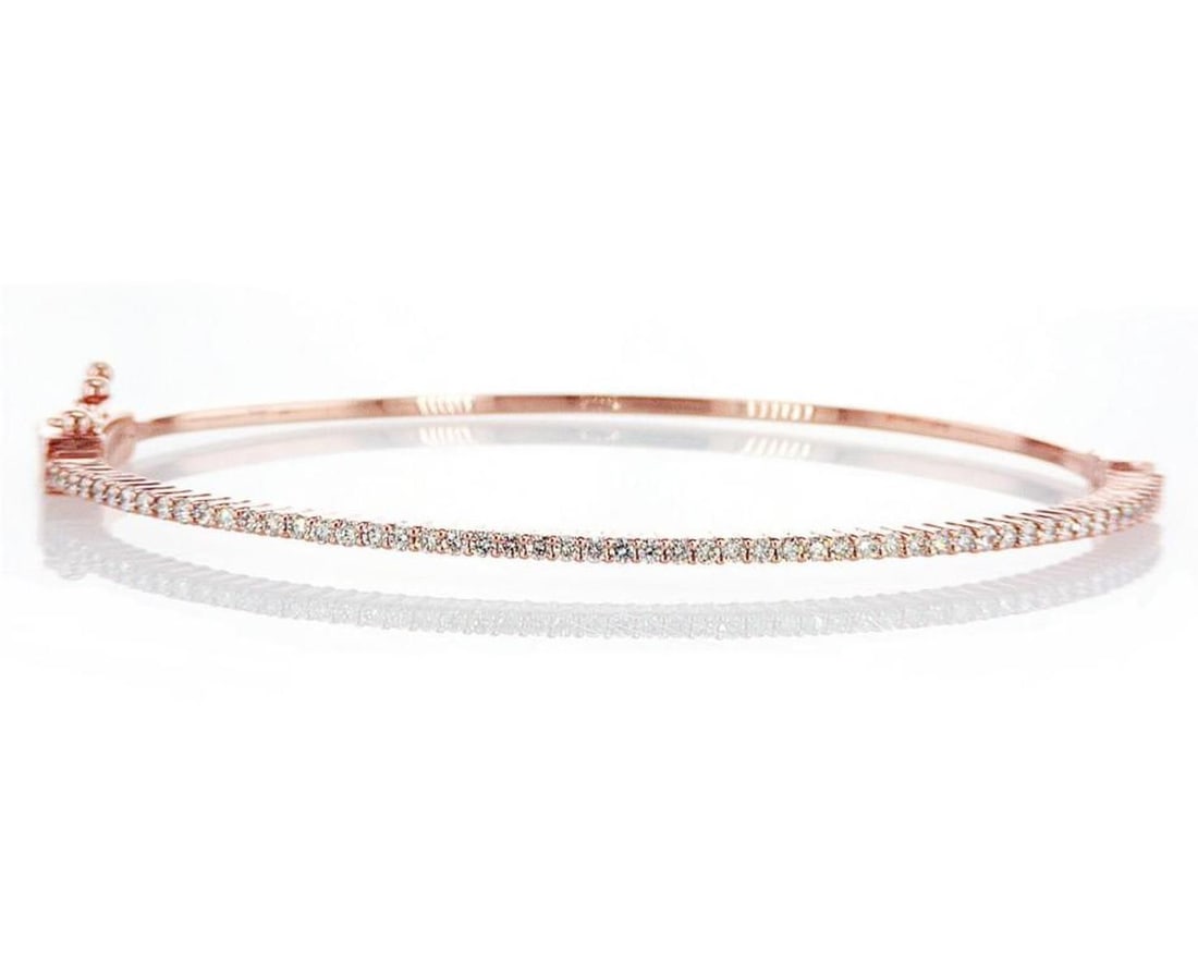 14kt Rose Gold 0.68ctw Diamond Bangle: Jewelry Description Description: One 14k rose gold bangle, set with natural diamonds. Jewelry Weight: 7.96 Grs Total Diamonds Weight: 0.68 Cts Precious Metal: 14kt Rose Gold Certificate Number: DSL- 4