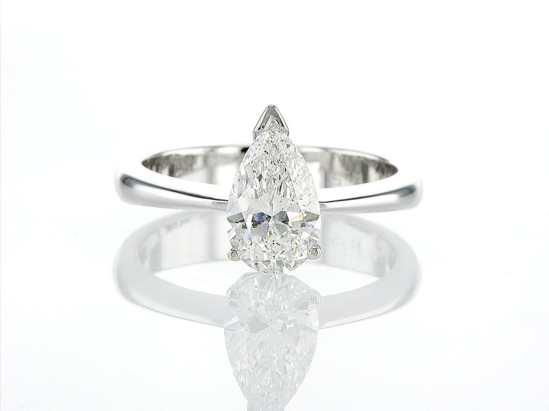 14kt White Gold 2ctw Diamond Ring: One 14k white gold ring (585 stamped), set with one center natural diamond. Jewelry Weight: 5.34Grs Total Diamonds Weight: 2Cts Main Stones Description: Quantity: 1 Cut and shape: Pear Carats Weight: 