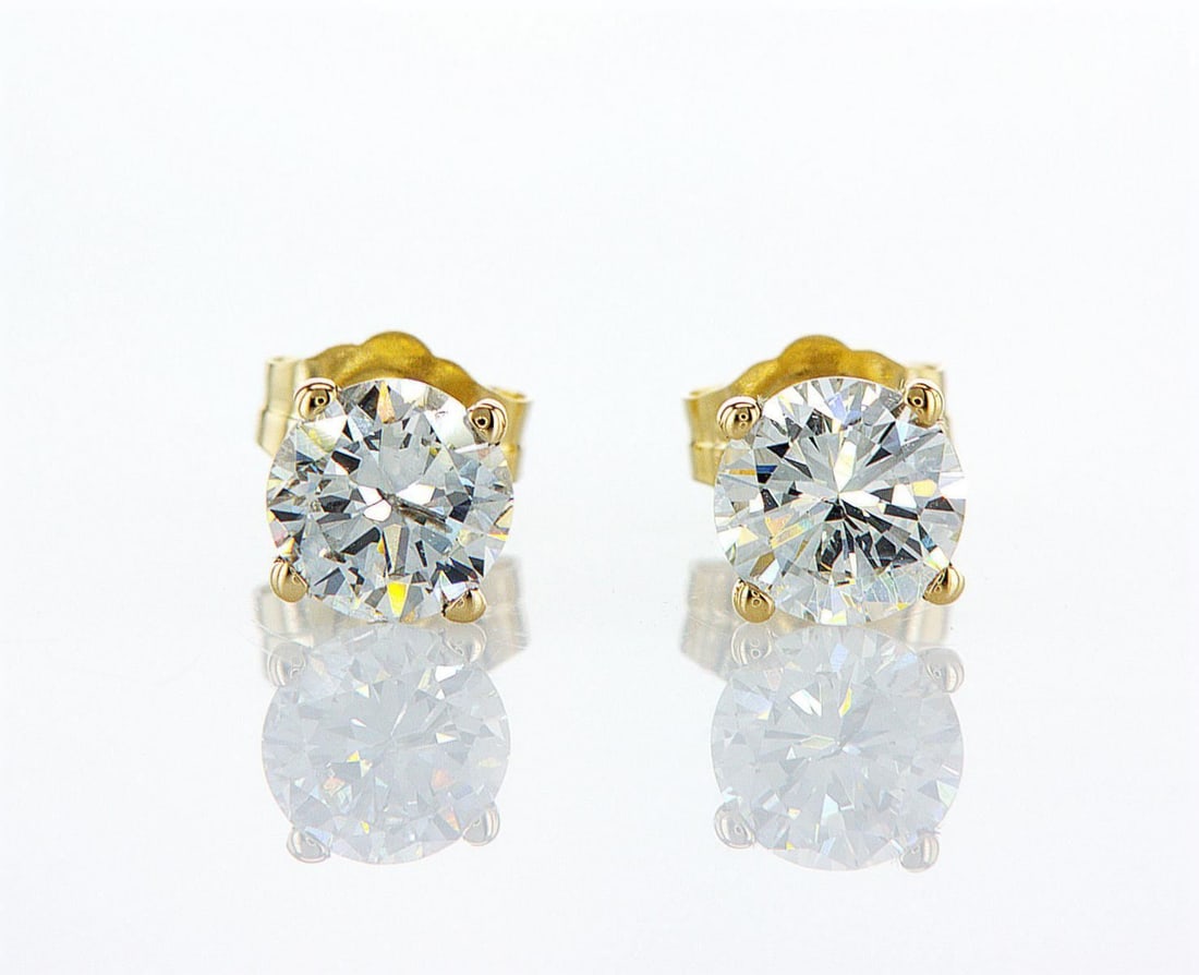 14kt Yellow Gold 1.23ctw Diamond Earrings: One pair of 14k yellow gold earrings (14k stamped), each set with one natural diamond Jewelry Weight: 0.84Grs Total Diamonds Weight: 1.23Cts Main Stones Description: Quantity: 2 Cut and shape: Round B