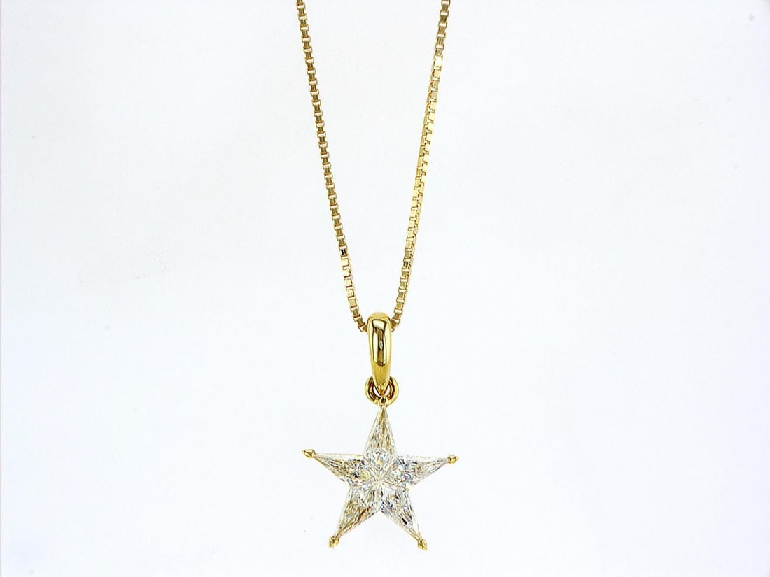 14kt Yellow Gold 0.76ctw Diamond Pendant: One 14k yellow gold pendant with chain (585 stamped), set with five natural diamonds Jewelry Weight: 2.86Grs Total Diamonds Weight: 0.76Cts Main Stones Description: Quantity: 5 Cut and shape: Noble Cu