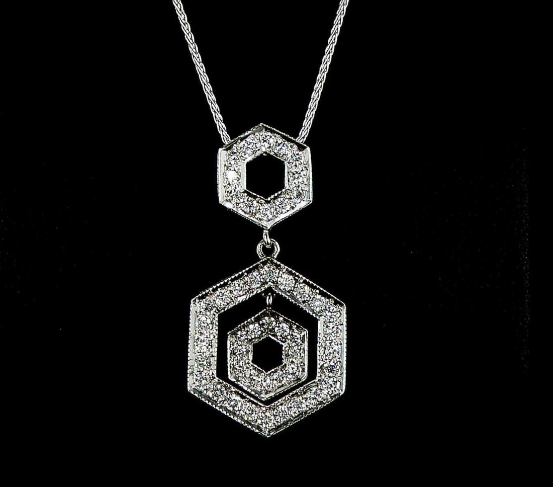 14kt White Gold 0.98ctw Diamond Pendant: One 14k white gold pendant with chain (14k stamped), set with small natural diamonds. Jewelry Weight: 5.56Grs Total Diamonds Weight: 0.98Cts Main Stones Description: Cut and shape: Round Brilliant