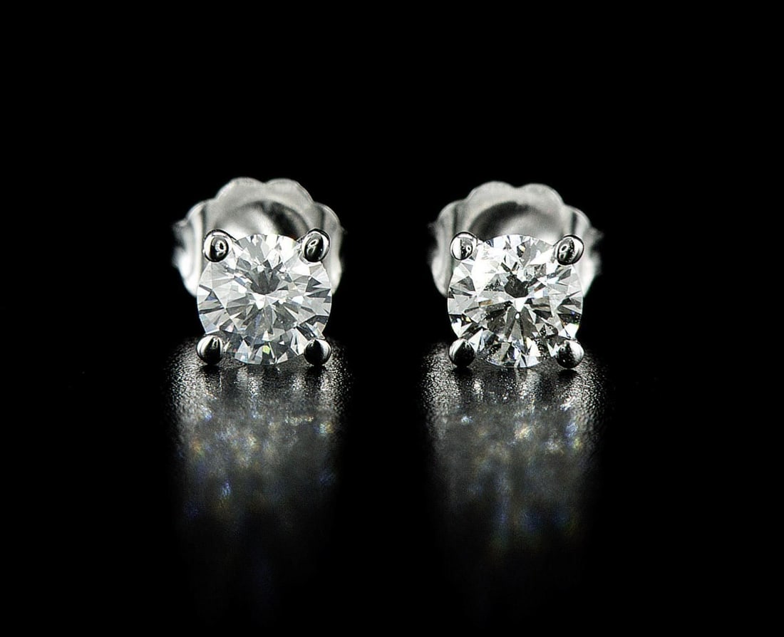 14kt White Gold 0.78ctw Diamond Earrings: One pair of 14k white gold earrings, each set with one natural diamond. Jewelry Weight: 0.83Grs Total Diamonds Weight: 0.78Cts Main Stones Description: Quantity: 2 Cut and shape: Round Brilliant Carat