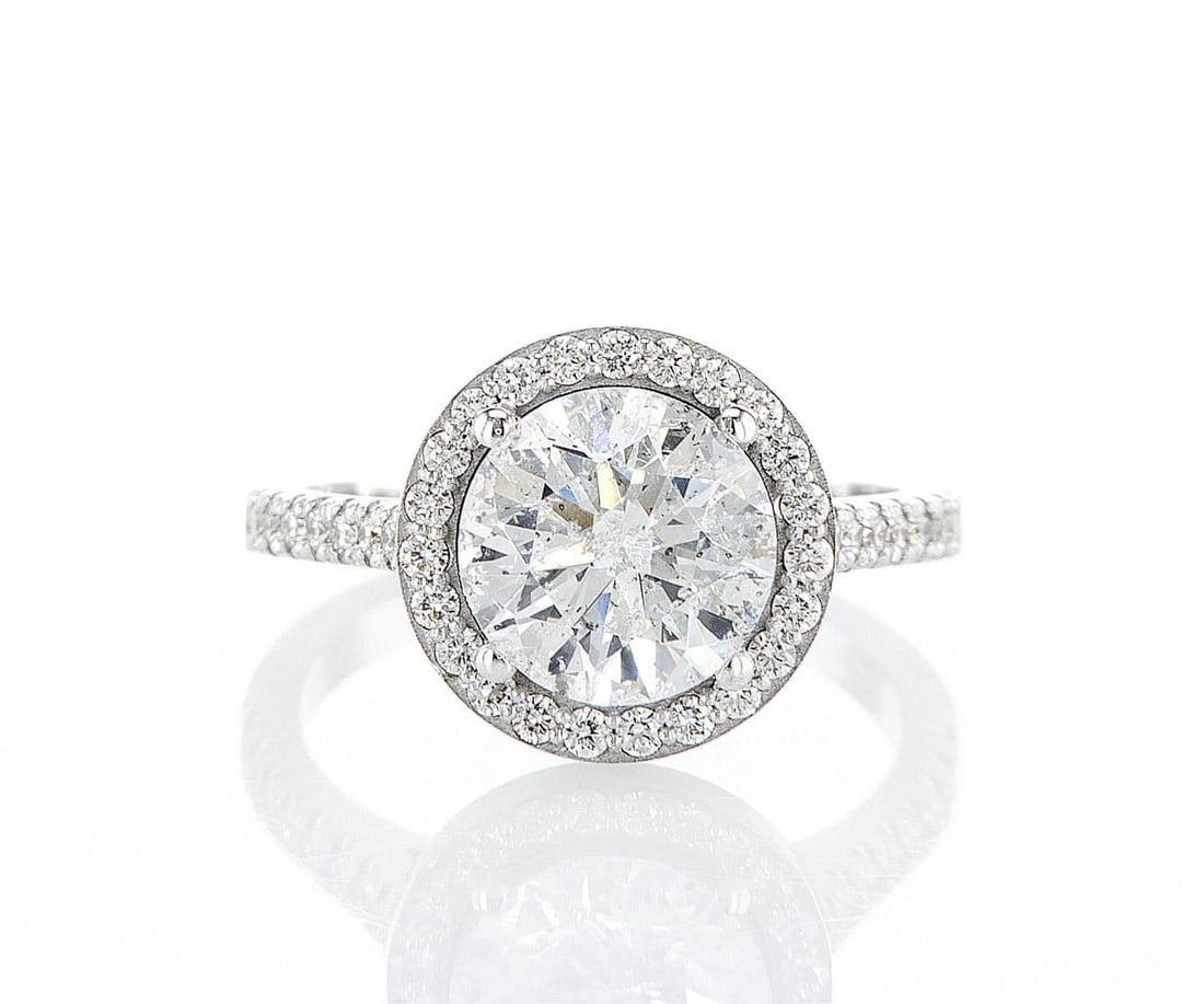 14kt White Gold 2.93ctw Diamond Ring: One 14k white gold ring, set with natural diamond. Jewelry Weight: 3.94Grs Total Diamonds Weight: 2.93Cts Main Stones Description: Quantity: 1 Cut and shape: Round Brilliant Carats Weight: 2.54 Clarit