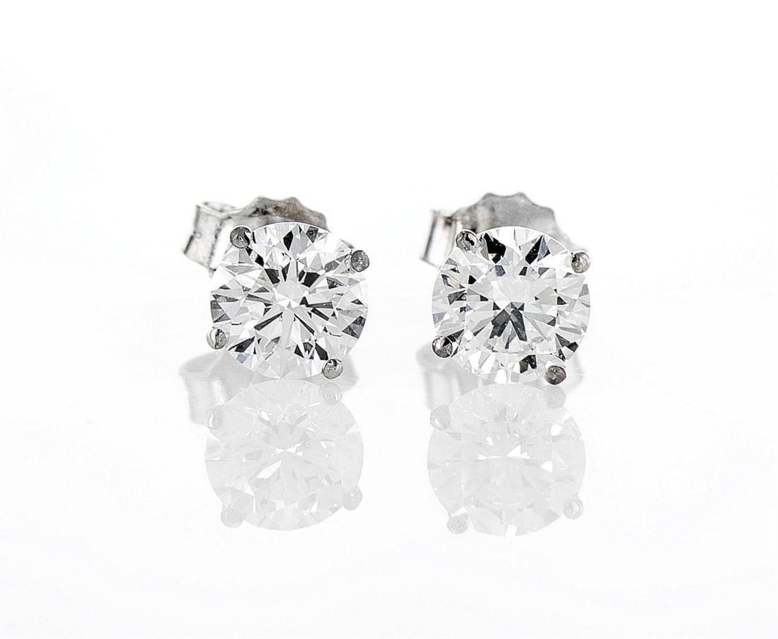 14kt White Gold 2.05ctw Diamond Earrings: One pair of 14k white gold earrings, each set with one lab grown diamond. Jewelry Weight: 1.33Grs Total Diamonds Weight: 2.05Cts Main Stones Description: Quantity: 2 Cut and shape: Round Brilliant Car