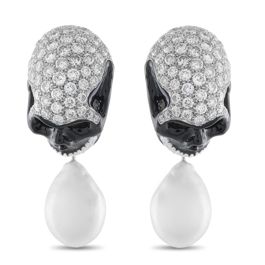 18K WHITE GOLD 10.50CT DIAMOND AND PEARL SKULL EARRINGS: These earrings perfectly combine high-end luxury with contemporary attitude. The skull-shaped settings shine to life thanks to striking black accents and inset Diamonds with a total weight of 10.50 ca