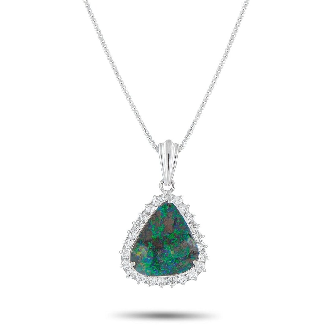 PLATINUM 0.60CT DIAMOND AND OPAL NECKLACE: A genuinely unique piece, this necklace is designed with a 4.38-carat opal offering vibrant flashes of green, bronze, and blue-violet hues that seem to shift with every moment. The remarkable play of 
