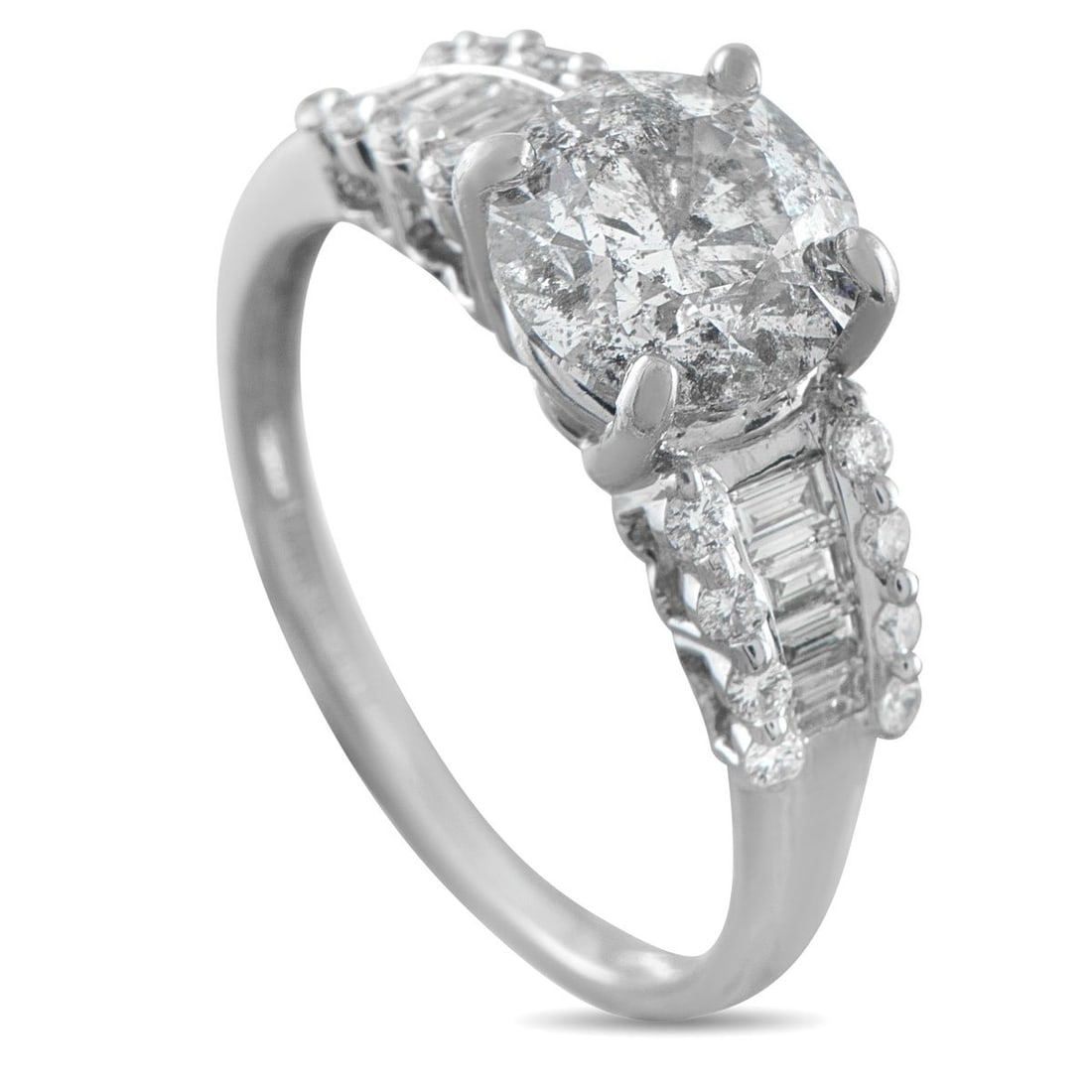 14K WHITE GOLD 2.50CT DIAMOND RING: Classic at first glance, the details of this ring become more intricate the closer you look. A 2-carat center diamond rises from four polished prongs, flanked by channel-set baguette diamonds that gra