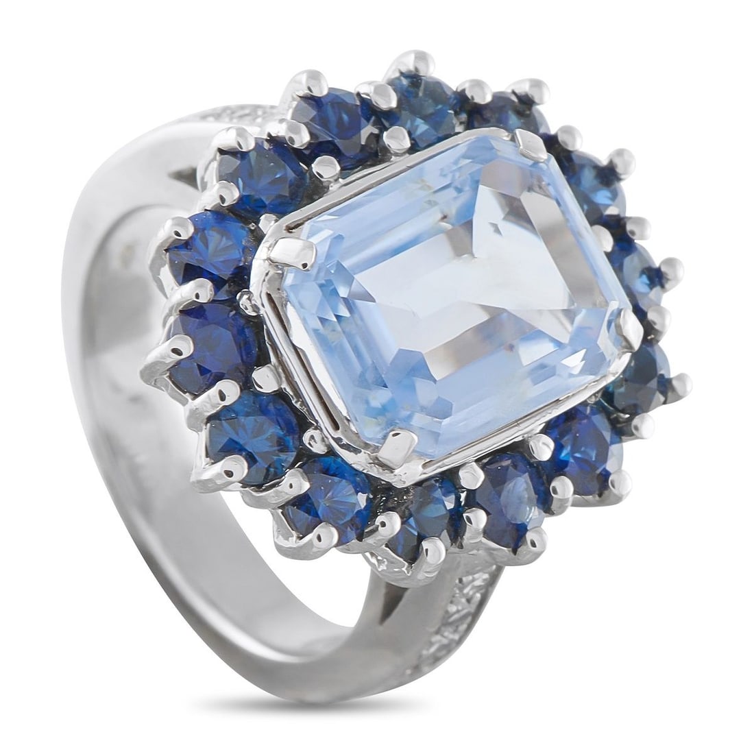 14K WHITE AND YELLOW GOLD 0.08CT DIAMOND AND SAPPHIRE RING: Sapphires with a total weight of 6.11 carats contrast beautifully at the top of this exquisite ring. Impeccably crafted, Diamonds with a total weight of 0.08 carats extend onto the band for an added t