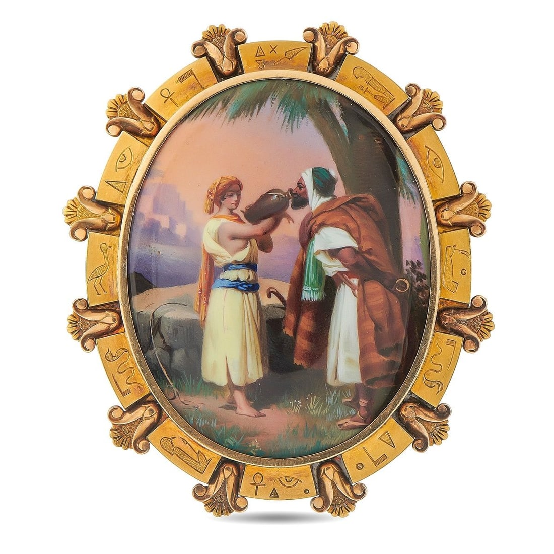 18K YELLOW GOLD VICTORIAN EGYPTIAN REVIVAL HAND-PAINTED ENAMEL BROOCH: An exceptional Victorian Egyptian Revival brooch in 18K yellow gold, centering an exquisitely hand-painted enamel miniature depicting an orientalist scene of figures in traditional dress beside a palm