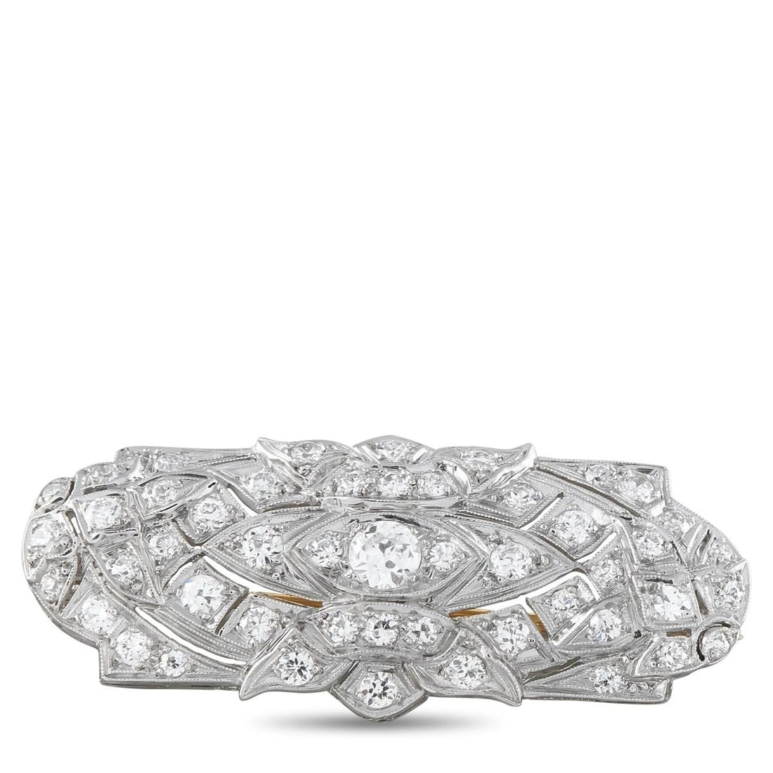 TIFFANY & CO. PLATINUM 1.50CT DIAMOND ART DECO BROOCH: A stunning Art Deco brooch by Tiffany and Co. in platinum, set throughout with old European and single-cut diamonds totaling 1.50 carats in an elongated navette-form openwork design. The geometric mil