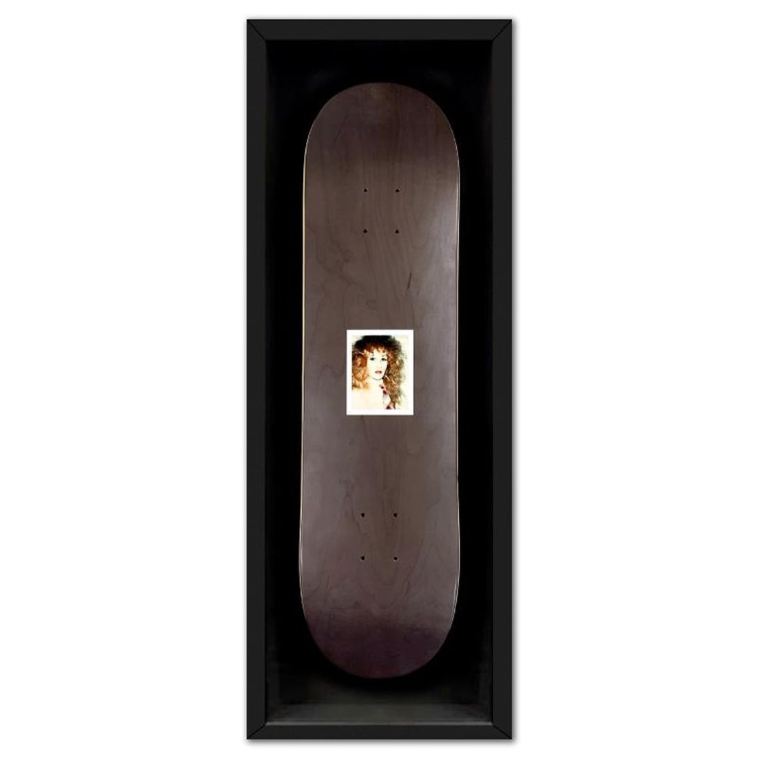 Andy Warhol (1928-1987), "Self Portrait (Black)" Framed Unique Edition Skateboard, Plate Signed with: Self Portrait (Black) is a skateboard by Andy Warhol (1928-1987), bearing the plate signature of the artist. This piece comes custom framed. This piece is from a unique edition in partnership with The