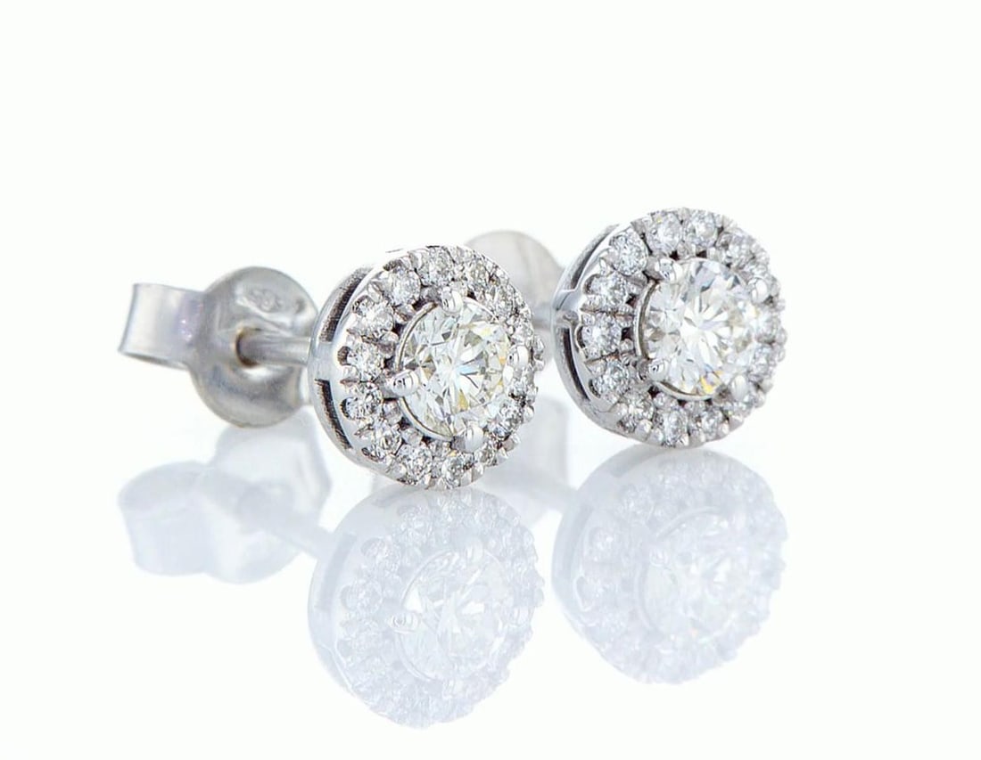 14kt White Gold 0.8ctw Diamond Earrings: One gr. 14kt White Gold Diamond Earrings Jewelry Weight: Grs Total Diamonds Weight: 0.8Cts Main Stones Description: Quantity: 2 Cut and shape: Round Brilliant Carats Weight: 0.6 Clarity: VS2 Color: G 