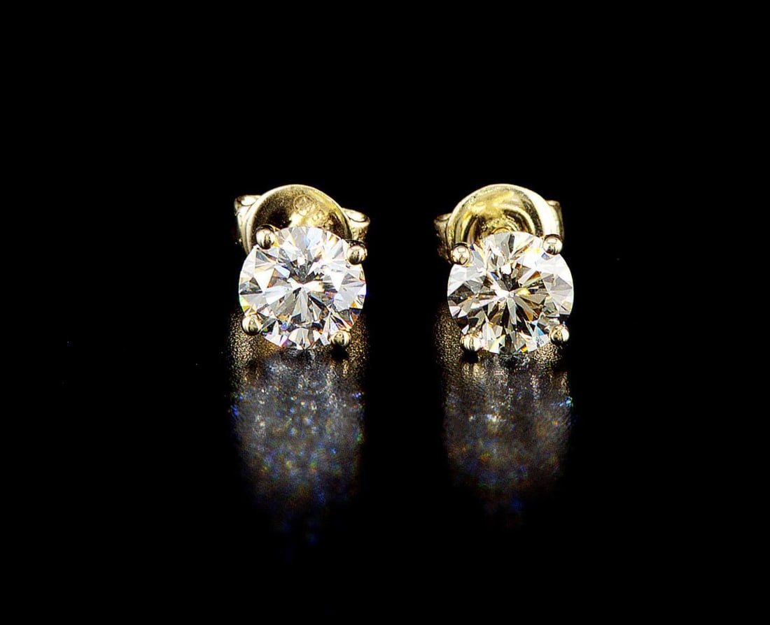 14k Yellow gold 1.61ctw Diamond Earrings: One pair of 14k yellow gold earrings (585 stamped), each set with one natural diamond. Jewelry Weight: 1.36Grs Total Diamonds Weight: 1.61Cts Main Stones Description: Quantity: 2 Cut and shape: Round 