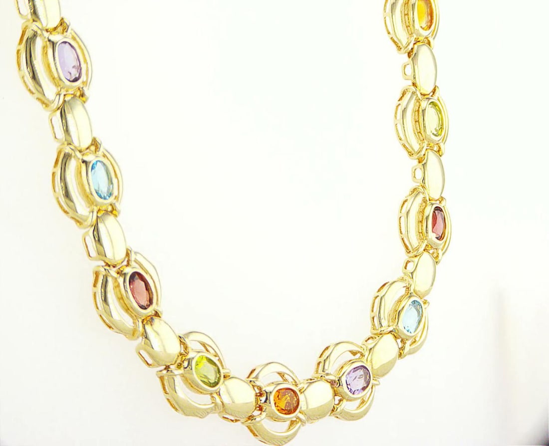 14K Yellow Gold Necklace: Jewelry Description Description: 14K Yellow Gold Necklace, 26 semi-precious gemstones (Garnet, Topaz, Peridot, Citrine, Amethyst) Jewelry Weight: 43.99 Grs Precious Metal: 14K Yellow Gold Certificate 