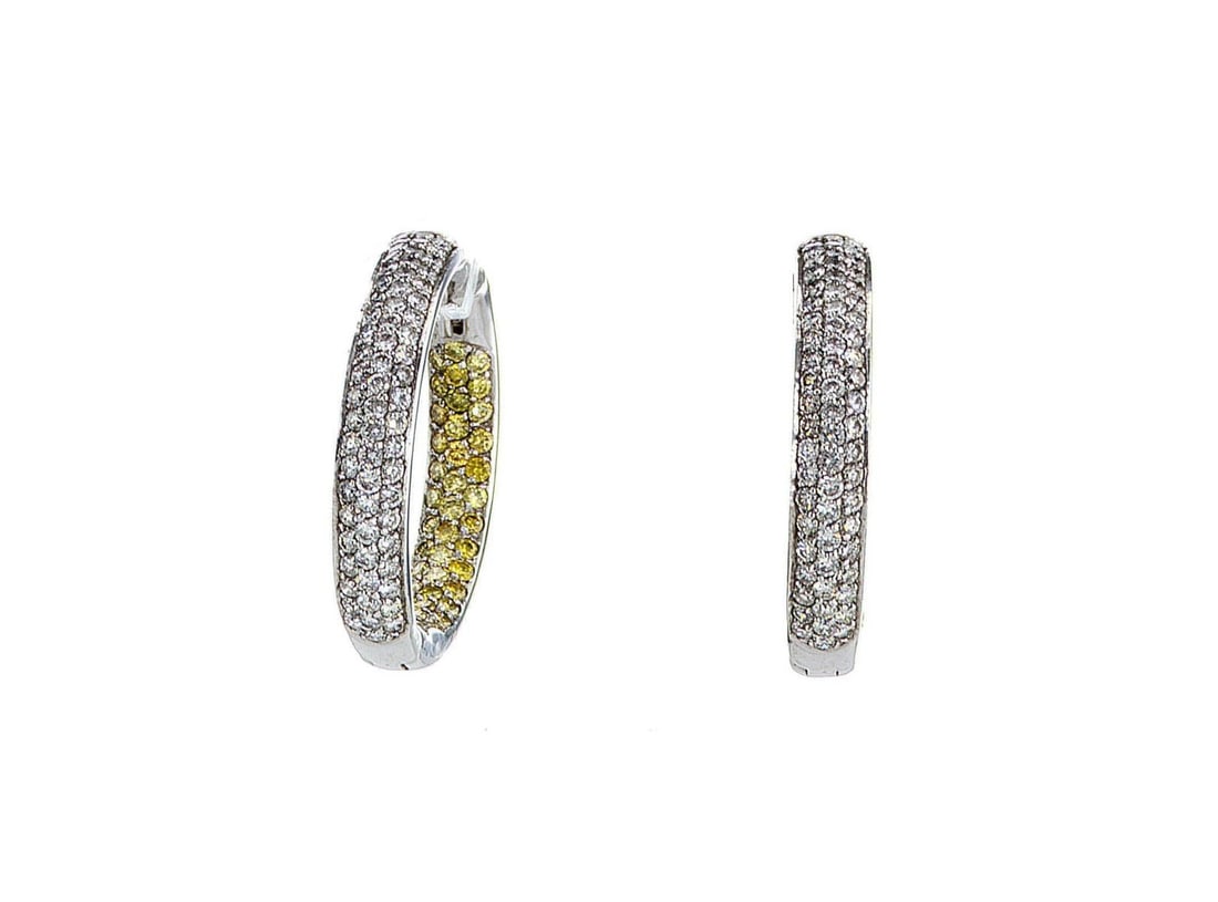 14kt White Gold 2.08ctw Diamond Earrings: One pair of 14k white gold earrings, each set with natural diamonds. Jewelry Weight: 12.3Grs Total Diamonds Weight: 2.08Cts Main Stones Description: Quantity: 128 Cut and shape: Round Brilliant Carats