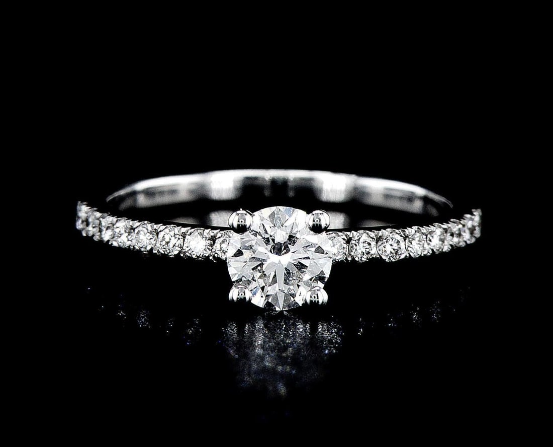 14kt White Gold 0.8ctw Diamond Ring: One 14k white gold ring (14k stamped), set with one center lab grown diamond and small lab grown diamonds around and on the sides. Jewelry Weight: 2.09Grs Total Diamonds Weight: 0.8Cts Main Stones Des