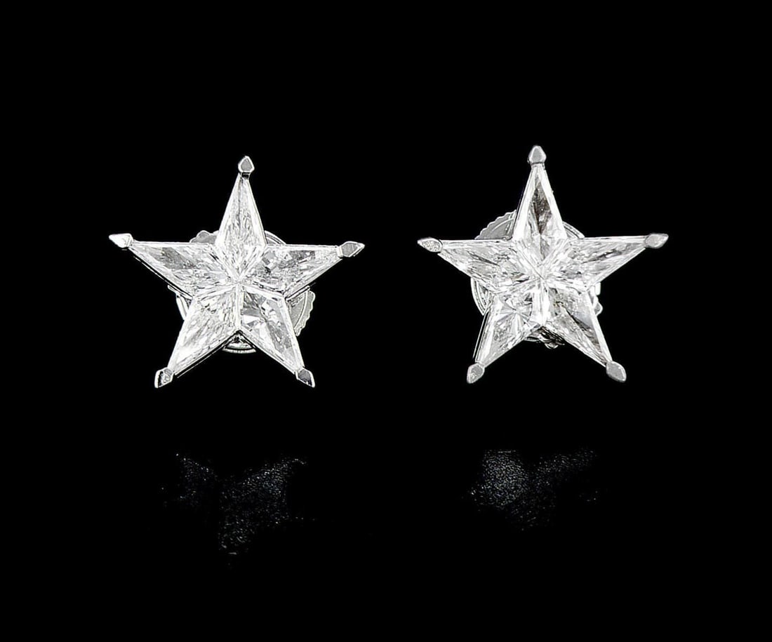 18kt White Gold 1.07ctw Diamond Earrings: One pair of 18k white gold earrings (18k stamped), each set with five natural diamonds Jewelry Weight: 2.42Grs Total Diamonds Weight: 1.07Cts Main Stones Description: Quantity: 10 Cut and shape: Noble