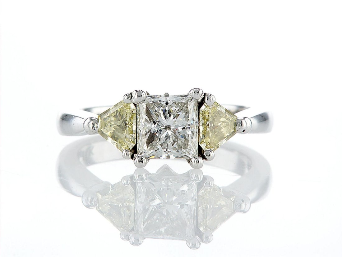 14kt White Gold 1.97ctw Diamond Ring: One 14k white gold ring (14k stamped), set with one center natural diamond and two natural diamonds on the sides. Jewelry Weight: 4.88Grs Total Diamonds Weight: 1.97Cts Main Stones Description: Quanti