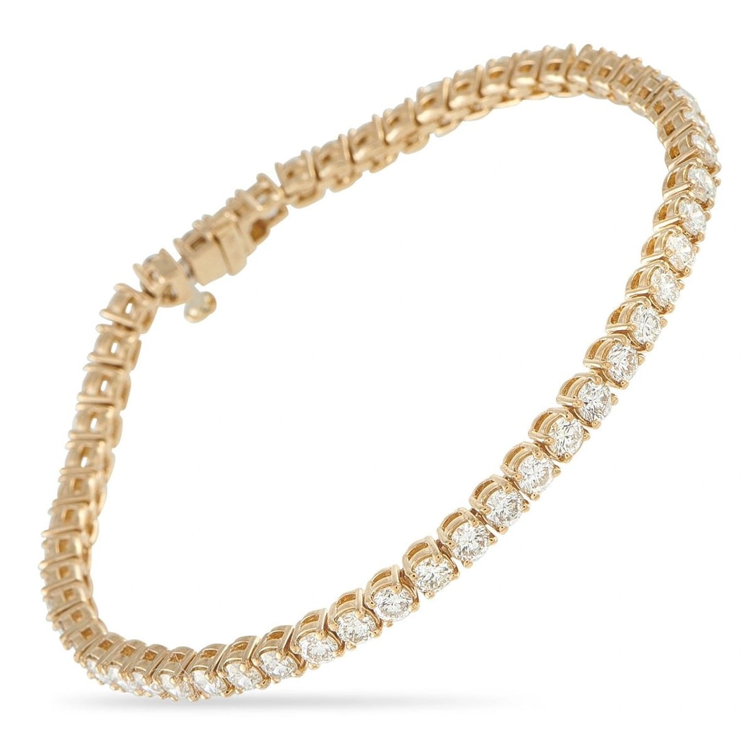 18K YELLOW GOLD 5.90CT DIAMOND TENNIS BRACELET: A series of sparkling Diamonds totaling 5.90 carats make this tennis bracelet a classic luxury piece. Simple and perfectly understated, the minimalist 18K Yellow Gold setting allows it to be worn with