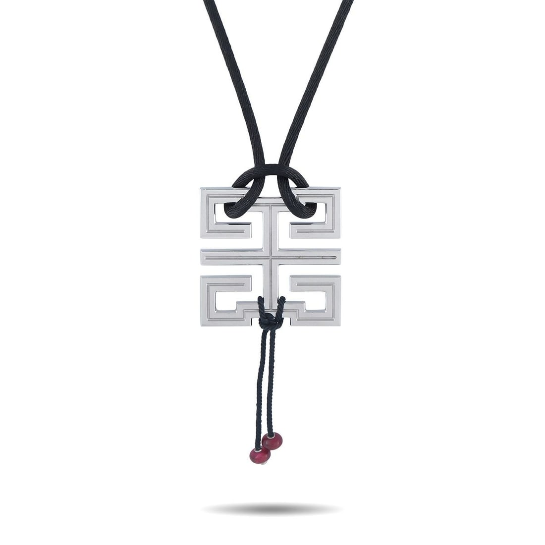 CARTIER LE BAISER DU DRAGON 18K WHITE GOLD NECKLACE: A Chinese inspired design makes a statement on this exquisite Cartier Le Baiser Du Dragon necklace. The 18K White Gold pendant measures 2.50 long by 1.25 wide and is suspended from a 20 black cord, wh
