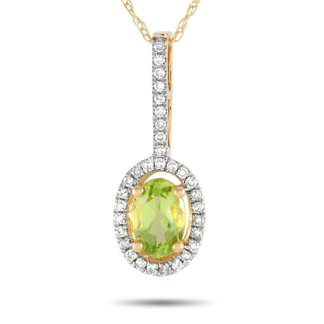 14K YELLOW GOLD 0.09CT DIAMOND AND PERIDOT PENDANT NECKLACE: A stunning oval-cut Peridot gemstone and sparkling Diamond accents totaling 0.09 carats come together beautifully on this necklaces simple, elegant pendant. Suspended from an 18 chain, the pendant mea