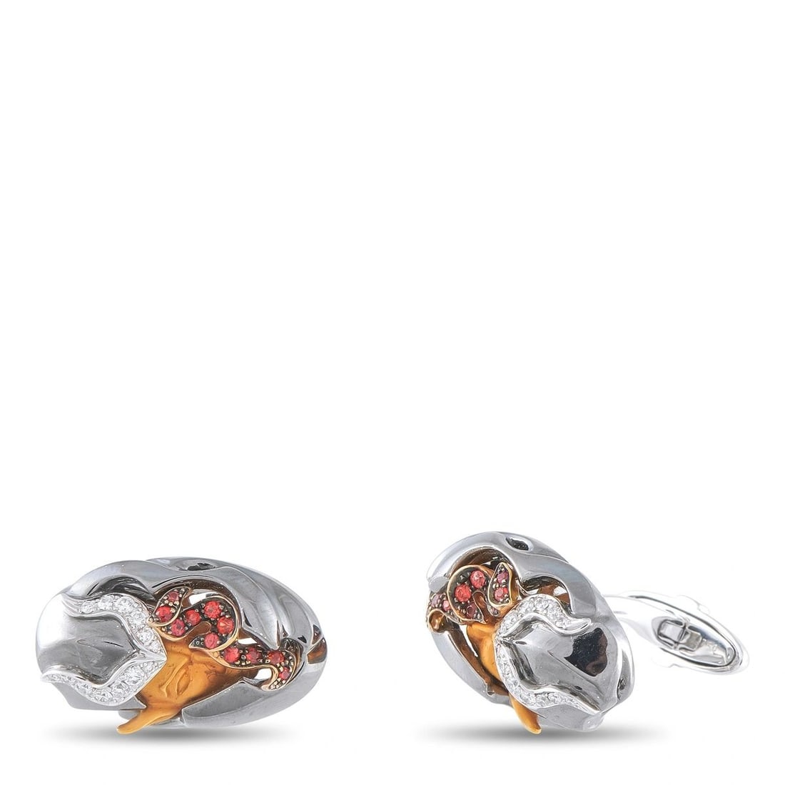 MAGERIT 18K WHITE GOLD DIAMOND DEVIL CUFFLINKS: These Magerit cufflinks offer a delightfully unexpected design. Set in 18K White Gold, Diamonds and red gemstone accents outline the carved Devil motif at the center. Each one measures 0.63 long by 0.