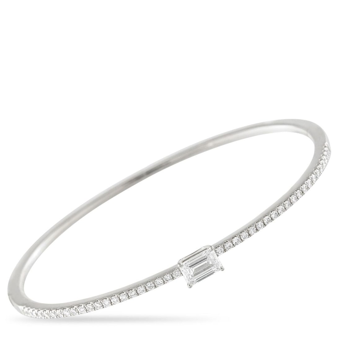 18K WHITE GOLD 1.30CT DIAMOND BANGLE BRACELET: Here is a diamond jewelry that fits into your routine as naturally as your favorite shirt. Crafted in 18K white gold, the slim bangle is defined by a front arc of petite round diamonds. At its center 