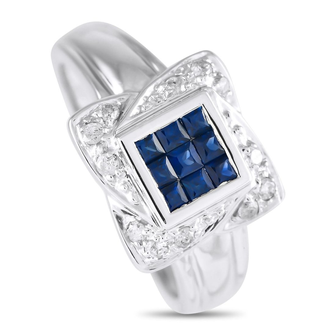 14K WHITE GOLD 0.15CT DIAMOND AND SAPPHIRE RING: Ideal for everyday wear, this delicate 14K White Gold ring is undeniably charming. An arrangement of deep blue Sapphire gemstones with a total weight of 0.42 carats make a statement at the center. A u
