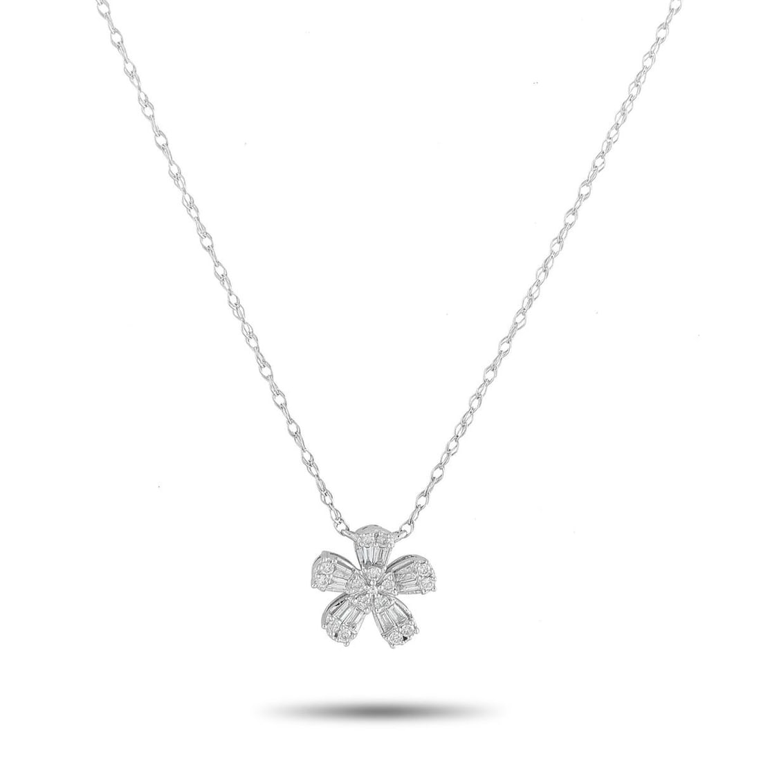 14K WHITE GOLD 0.20CT DIAMOND FLOWER PENDANT NECKLACE: A minimalist design makes this 14K White Gold necklace ideal for any occasion. Simple and perfectly understated, it features a floral-shaped pendant covered in Diamonds totaling 0.20 carats. The