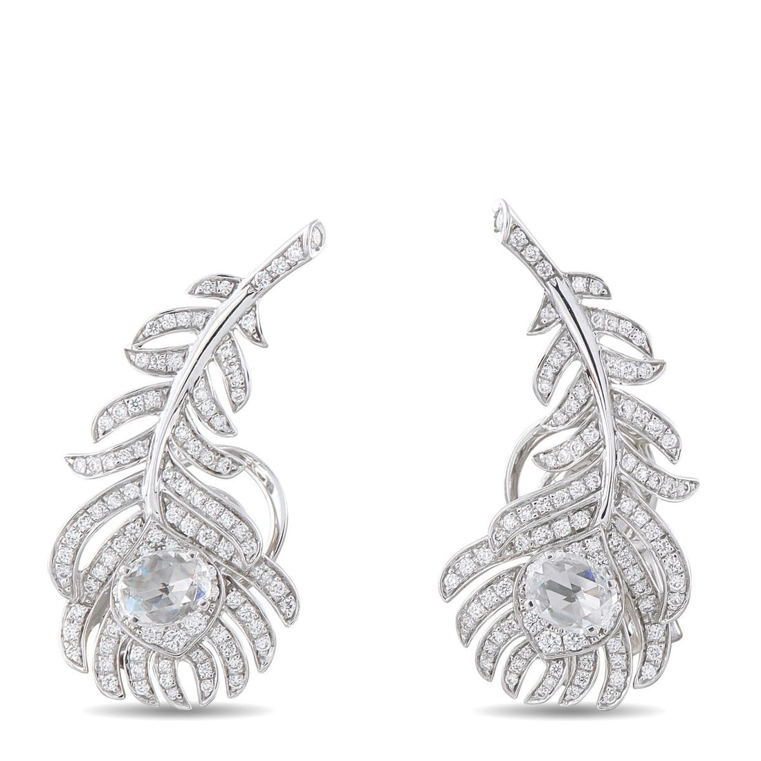 BOUCHERON PLUME DE PAON 18K WHITE GOLD 1.10CT DIAMOND EARRINGS: These dazzling Boucheron Plume de Paon earrings draw inspiration from the beauty of the natural world. Designed to resemble delicate peacock feathers, sparkling Diamonds totaling 1.10 carats make