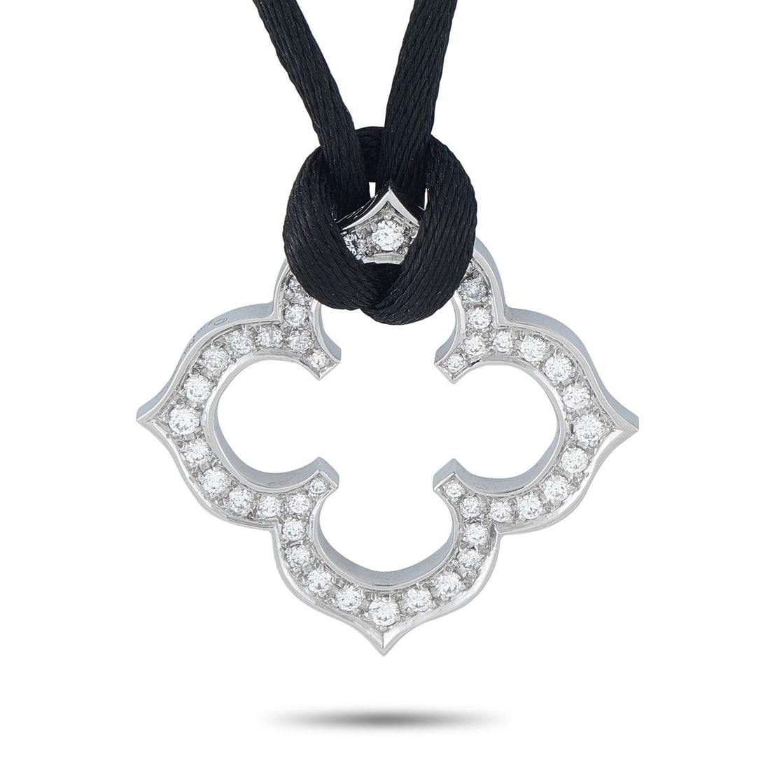 CARTIER QUATREFOIL 18K WHITE GOLD DIAMOND PENDANT NECKLACE: This Cartier Quatrefoil necklace is beautifully balanced. The 18K White Gold pendant measures 1.19 round and comes to life thanks to sparkling inset Diamonds. A 20 black cord allows you to dress it up