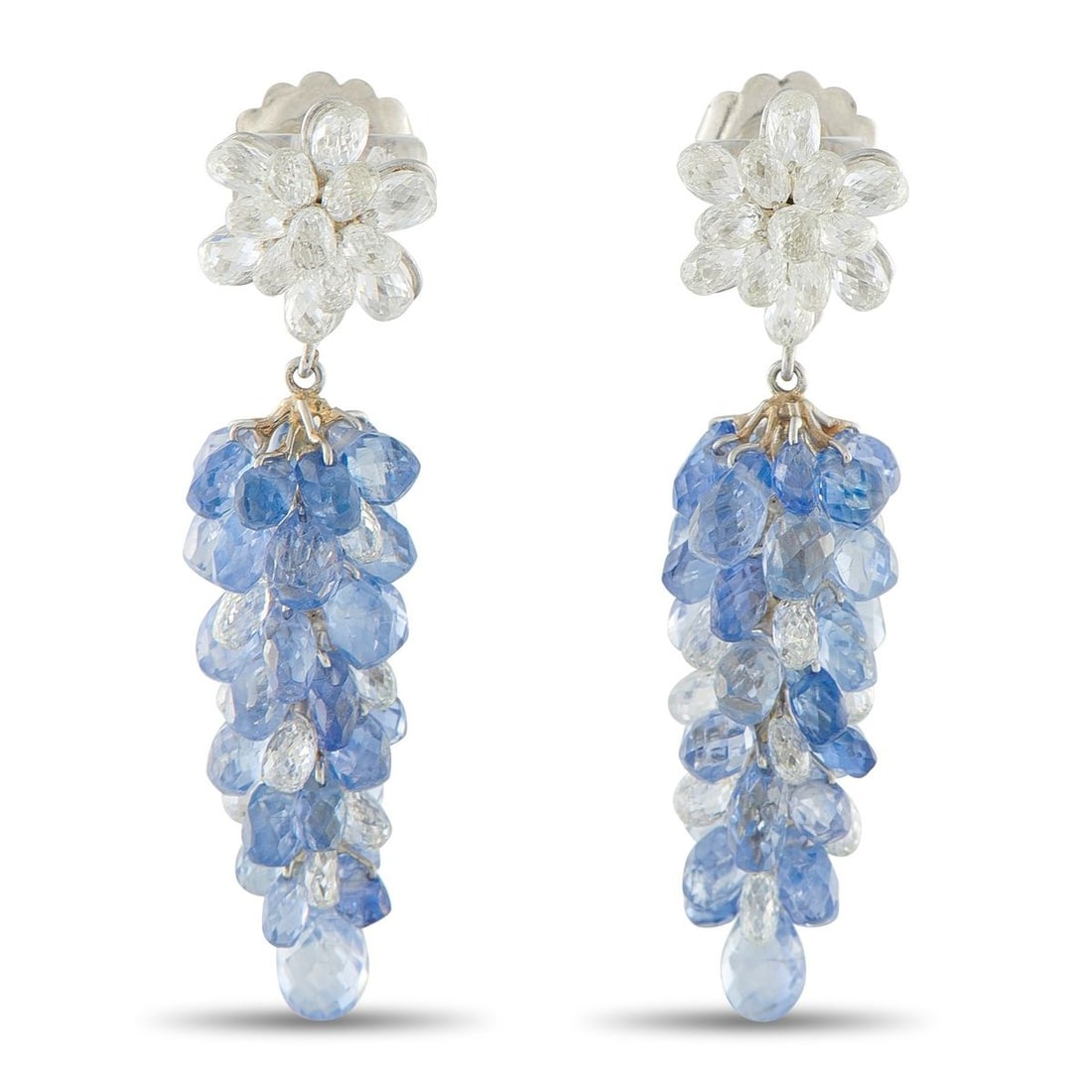 18K WHITE GOLD 5.0CT DIAMOND AND SAPPHIRE DANGLE EARRINGS: These uniquely elegant earrings are simply spectacular. At the base, Diamond briolettes with a total weight of 5.0 carats shine brightly every time they catch the light. Suspended below, a cascade of 
