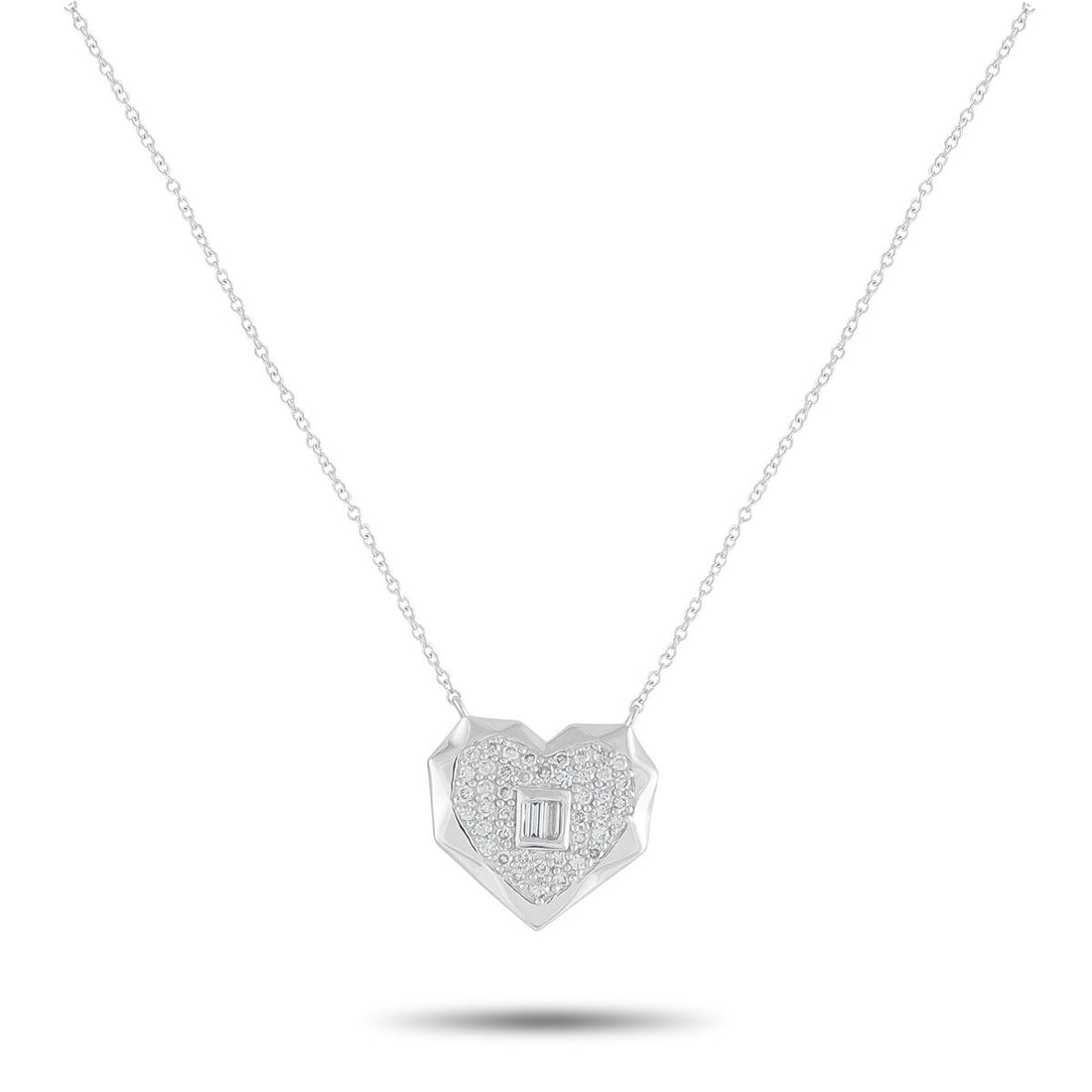 14K WHITE GOLD 0.40CT DIAMOND HEART PENDANT NECKLACE: An artistic heart-shaped pendant makes this 14K White Gold necklace incredibly eye-catching. Sparkling Diamonds with a total weight of 0.40 carats make it a luxurious addition to any ensemble. The dyn