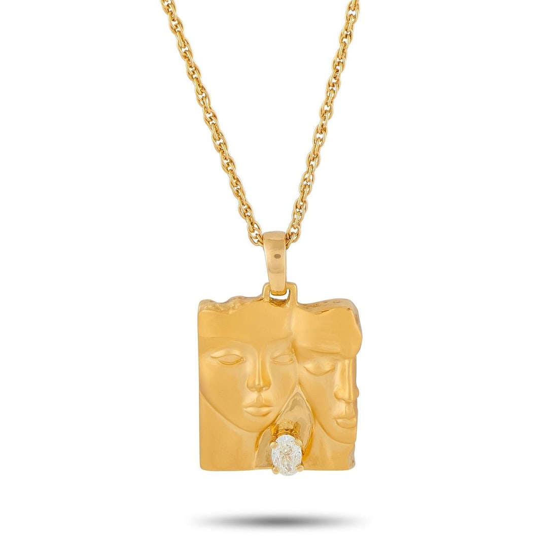 CARRERA Y CARRERA 18K YELLOW GOLD 0.50CT DIAMOND PENDANT NECKLACE: This Carrera Y Carrera necklace is a stylish accessory with artistic flair. A single 0.50 carat Diamond adds contrast to the 18K Yellow Gold pendant, which depicts two human forms. This pieces pendant